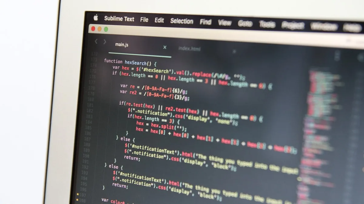 Source code open in a text editor on a laptop screen
